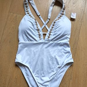 Kenneth Cole white bathing suit, size medium, with gold trim chain on front.